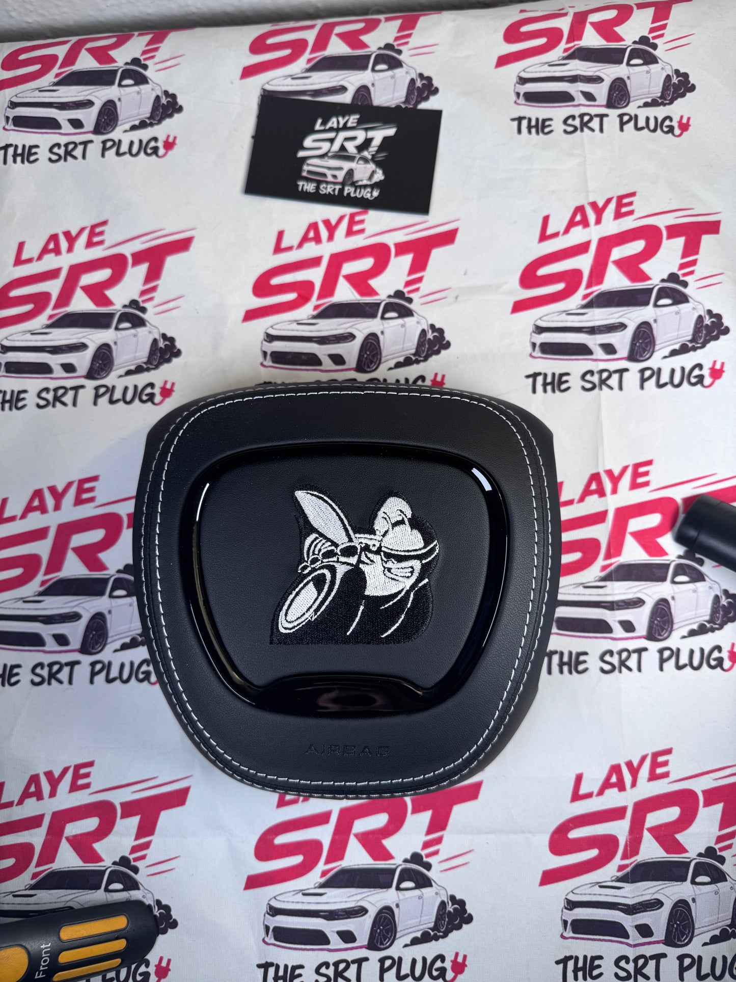 Scat pack bee leather airbag cover with white stitching